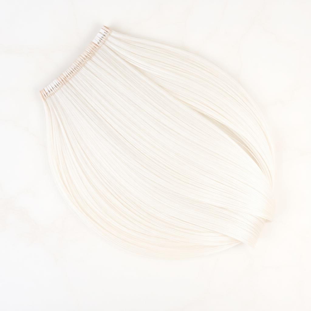 Wholesale Platinum Blonde #613 Tape-In Extensions in Shmeisani (Amman Banking), Amman (Capital Governorate), Jordan — front view · 100% human hair extensions — wholesale from India · Suvita Hair